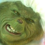 Jim Carrey relacionou o processo de vestir o traje peludo e verde de Grinch, que poderia levar mais de oito horas, a "ser enterrado vivo". (Foto: Reprodução)