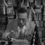 ikiru (Viver): Kanji Watanabe é um funcionário público que trabalha no mesmo departamento há 30 anos. Sua vida é muito chata e monótona, embora ele já tenha tido paixão e energia. Um dia, ele descobre que tem câncer e pode morrer em menos de um ano. Após a depressão inicial, ele começa a viver intensamente de novo. (Foto: Divulgação)